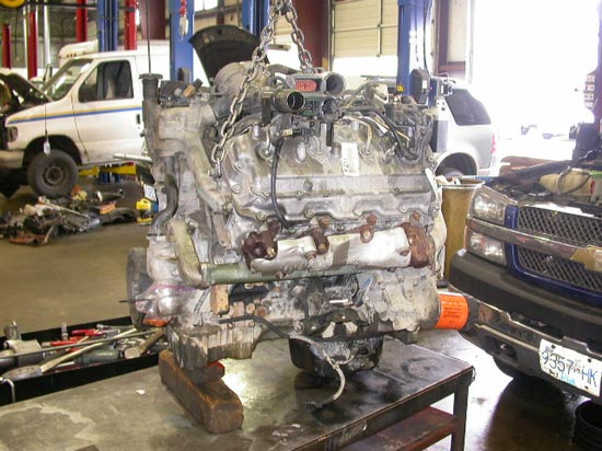 13_Chev_pickup_truck_engine_removed_on_hoist