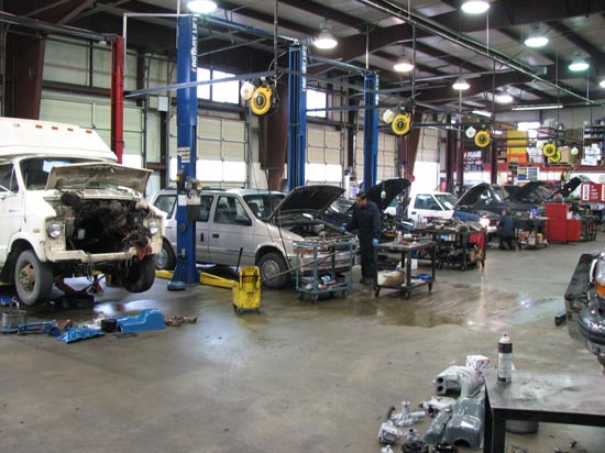 7_Ford_van_Chrysler_minivan_in_repair_shop