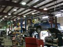 308_Work_trucks_on_hoists_for_new_engines