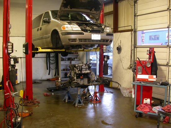 55_Chev_minivan_rebuilt_V6_engine_on_lift